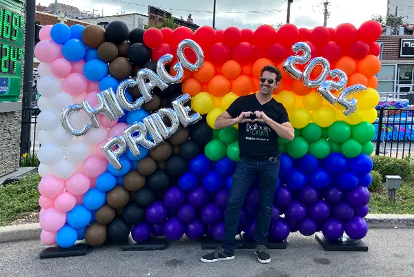 Celebrating Pride Month with colorful balloon displays.